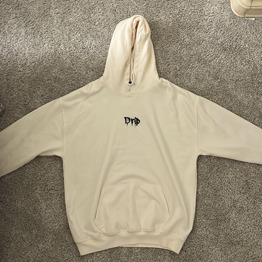 White/Cream colored “Drip” hoodie.